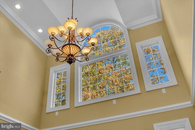 details with a chandelier and crown molding