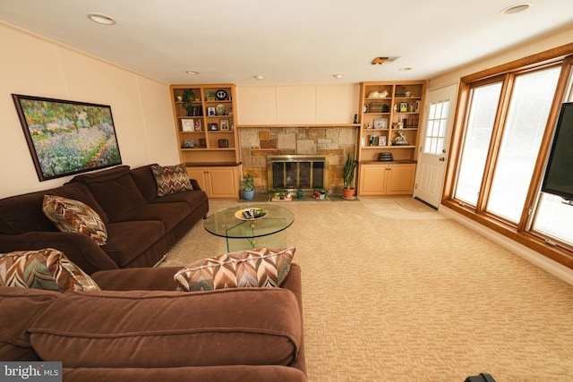 carpeted living room featuring a fireplace