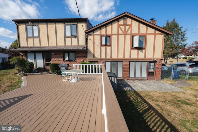 rear view of property with a yard