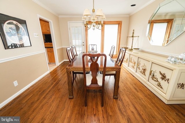 dining room featuring a chandelier, hardwood / wood-style floors, and ornamental molding