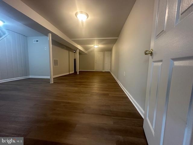 bonus room featuring dark hardwood / wood-style flooring