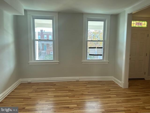 spare room with light wood-type flooring