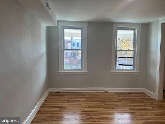 empty room featuring hardwood / wood-style floors