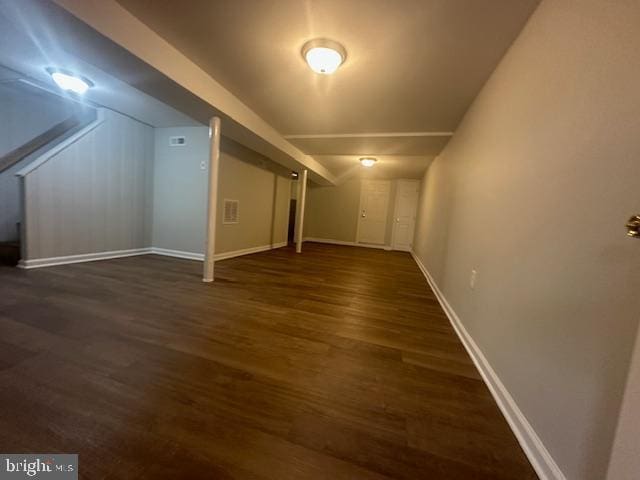 additional living space with dark hardwood / wood-style floors