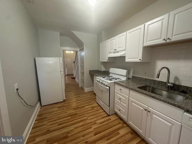 kitchen featuring white cabinets, white appliances, sink, and light hardwood / wood-style flooring