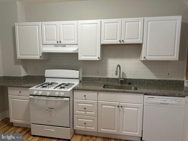 kitchen featuring white cabinets, light hardwood / wood-style floors, sink, and white appliances