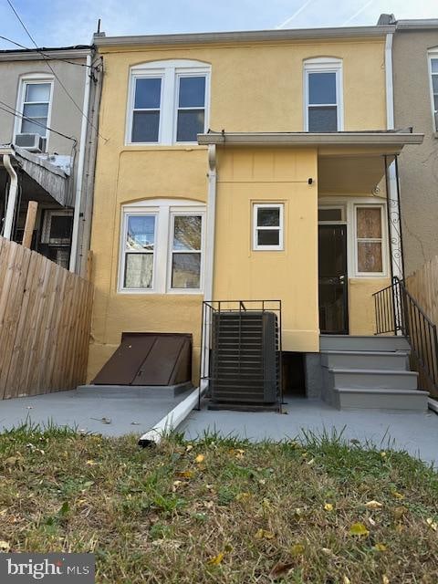 rear view of property featuring central air condition unit