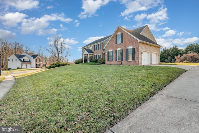 view of side of property with a lawn and a garage