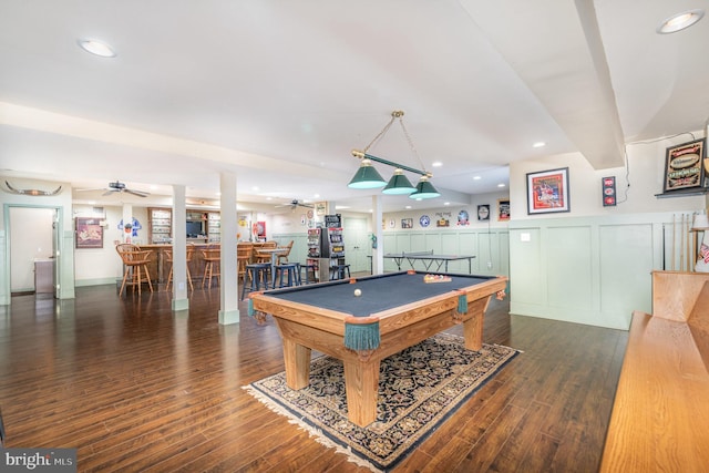 rec room with bar area, ceiling fan, dark wood-type flooring, and billiards