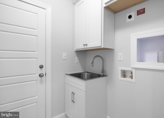 laundry area featuring cabinets, electric dryer hookup, sink, and washer hookup