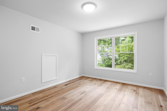 unfurnished room featuring light hardwood / wood-style flooring