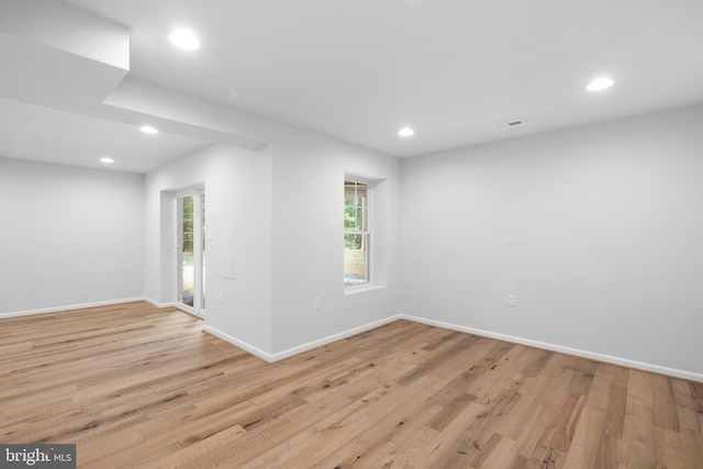 empty room featuring light hardwood / wood-style floors and a wealth of natural light