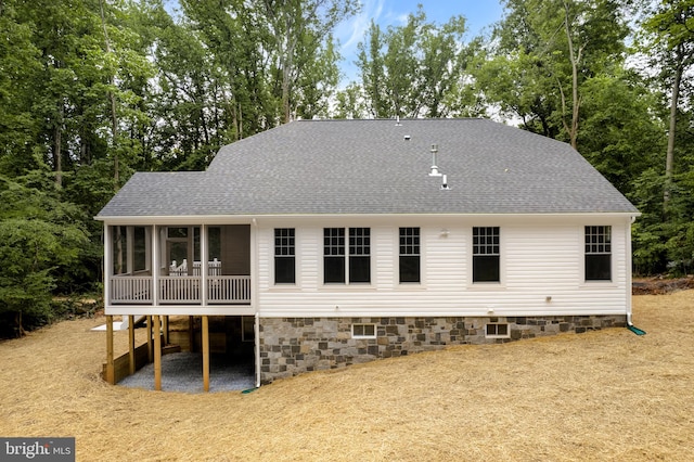 back of house with a sunroom