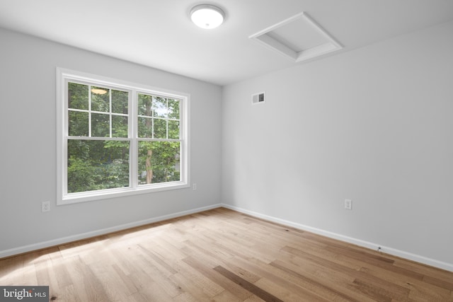 unfurnished room with light hardwood / wood-style floors