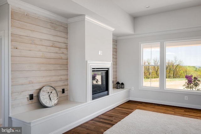 interior details with hardwood / wood-style floors and crown molding