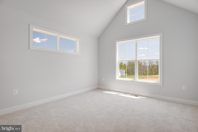 interior space featuring lofted ceiling and carpet floors