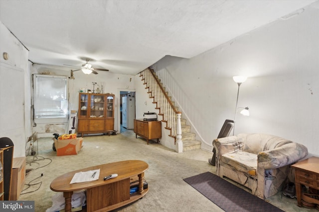 living room with ceiling fan and carpet floors