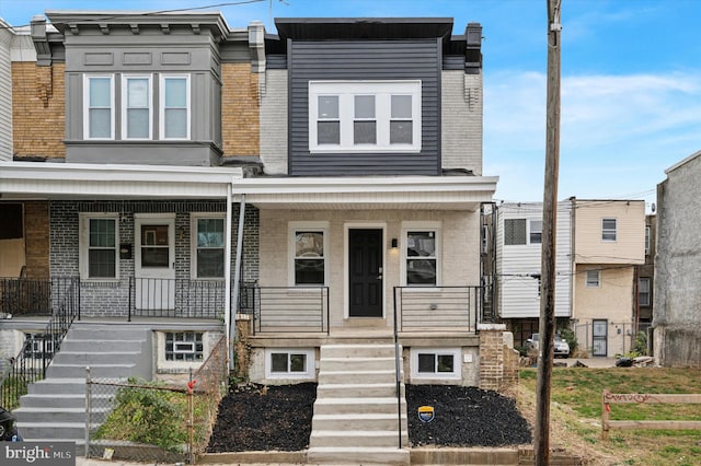 multi unit property featuring a porch