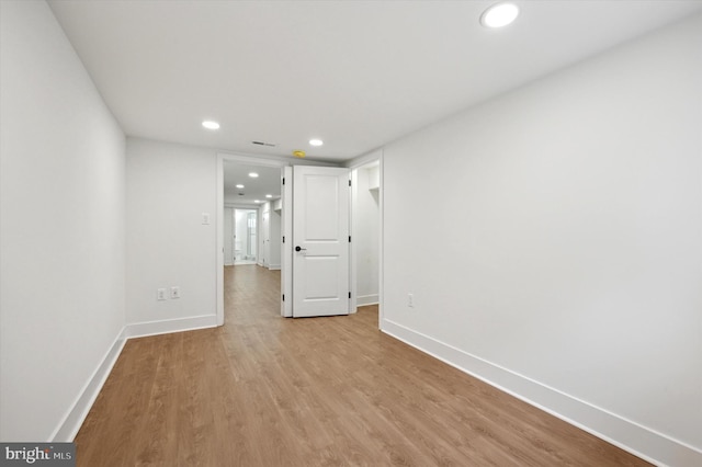 spare room with light wood-type flooring