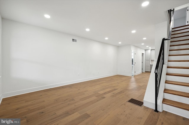 basement featuring light wood-type flooring