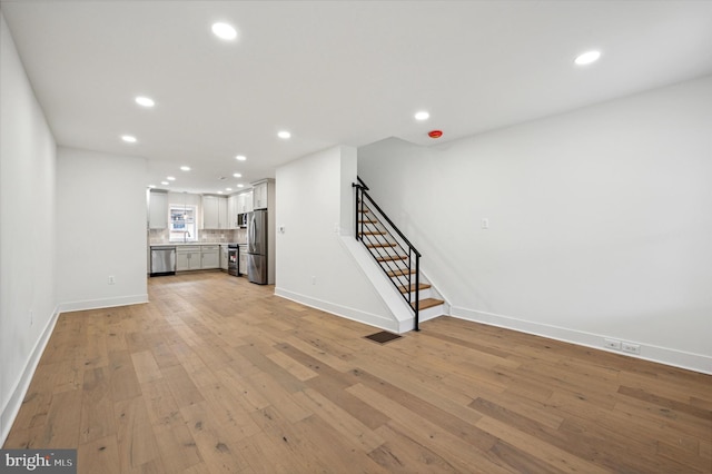 unfurnished living room featuring light hardwood / wood-style floors