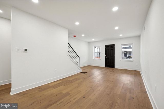 foyer entrance with hardwood / wood-style floors