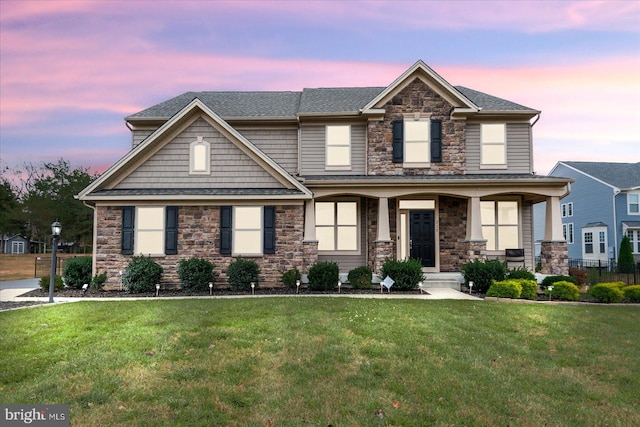 craftsman house featuring a lawn and a porch