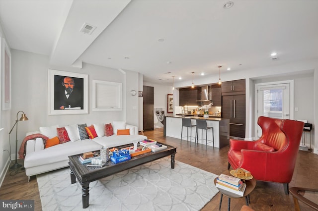 living room with dark hardwood / wood-style flooring