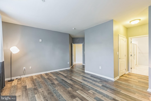 empty room featuring wood-type flooring