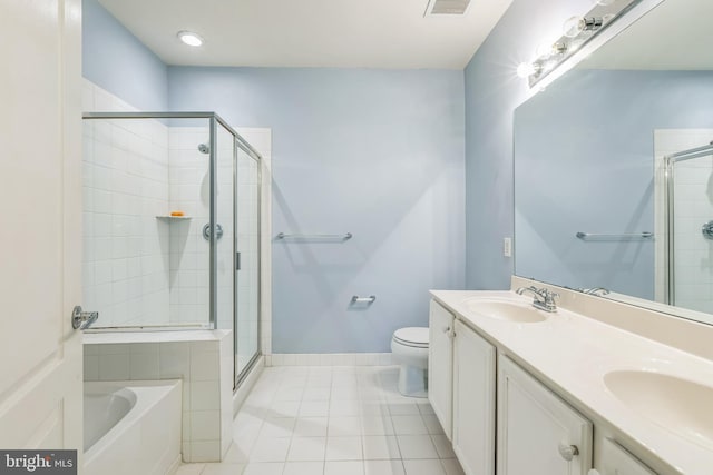 full bathroom featuring tile patterned flooring, vanity, separate shower and tub, and toilet