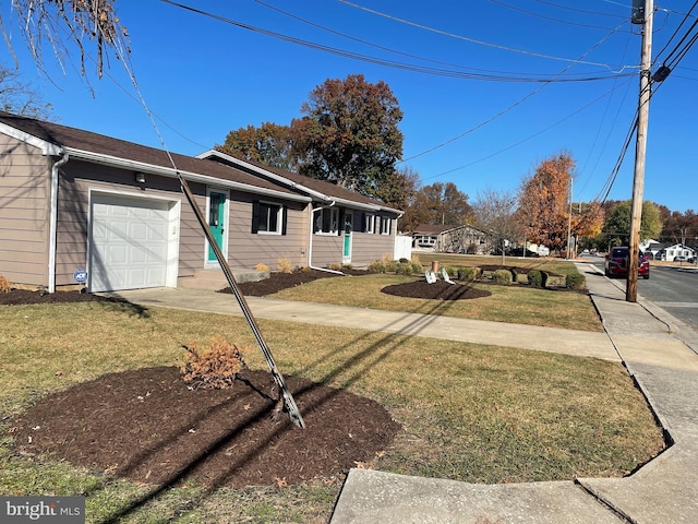 view of front facade with a front lawn and a garage