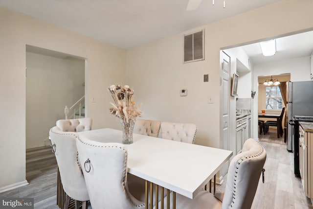 dining area with light hardwood / wood-style flooring