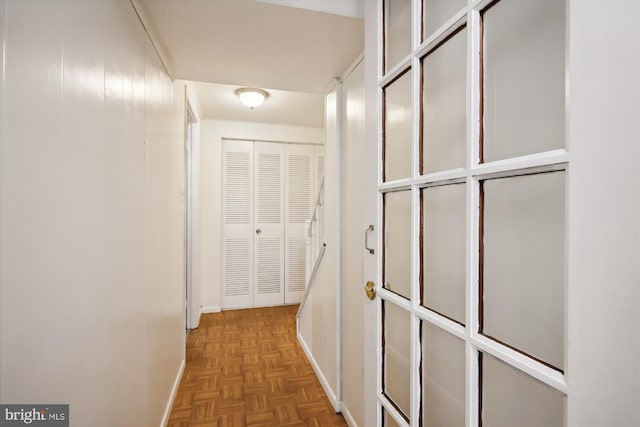 hallway featuring parquet floors