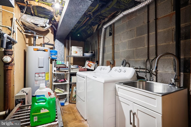 washroom featuring electric water heater, sink, and independent washer and dryer