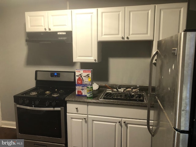 kitchen featuring white cabinets, dark wood-type flooring, and appliances with stainless steel finishes