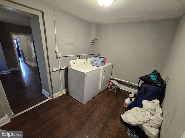 laundry area featuring washing machine and dryer and dark wood-type flooring