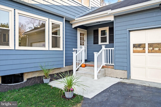 property entrance with a garage