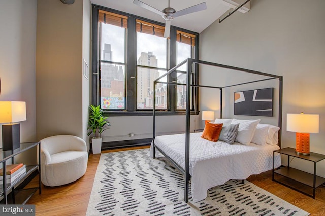 bedroom featuring ceiling fan and light hardwood / wood-style floors