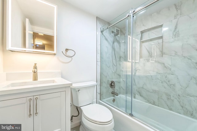 full bathroom with vanity, toilet, and enclosed tub / shower combo