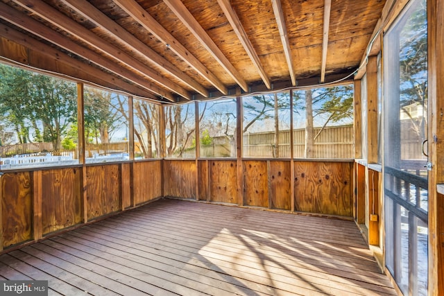 unfurnished sunroom with wood ceiling