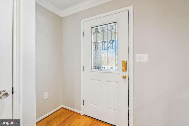 entryway featuring ornamental molding and light hardwood / wood-style floors