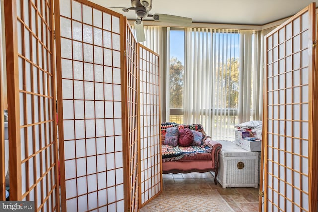 doorway to outside with ceiling fan