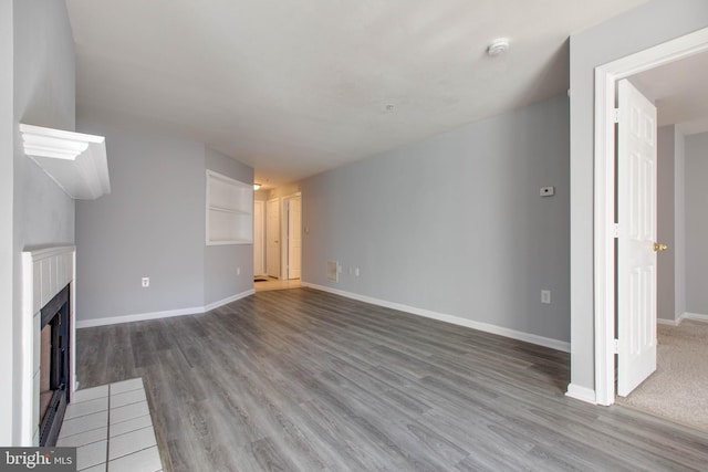 unfurnished living room featuring hardwood / wood-style floors