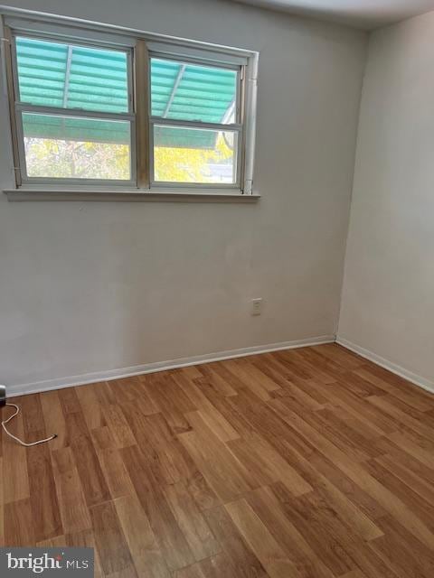 empty room featuring wood-type flooring