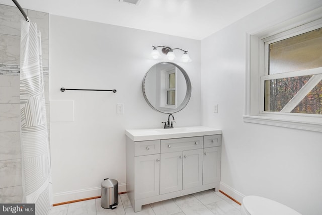 bathroom with vanity and toilet