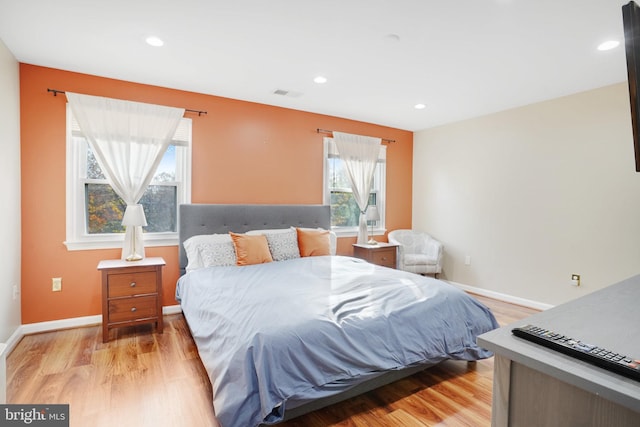 bedroom with light hardwood / wood-style flooring