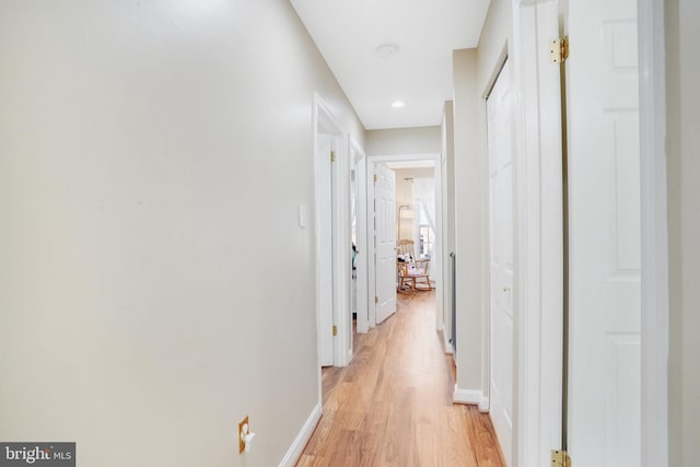 corridor featuring light hardwood / wood-style floors