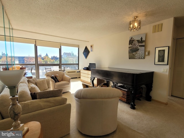 living room featuring a textured ceiling, light carpet, and a notable chandelier