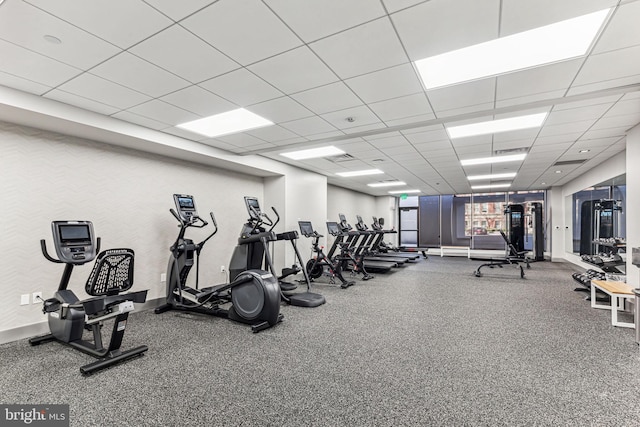 exercise room with a drop ceiling