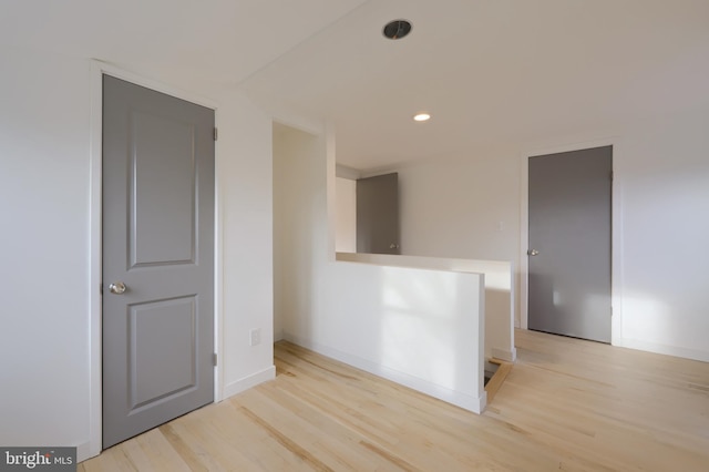 empty room with light hardwood / wood-style flooring